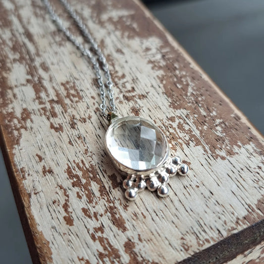 Clear quartz and silver pendant