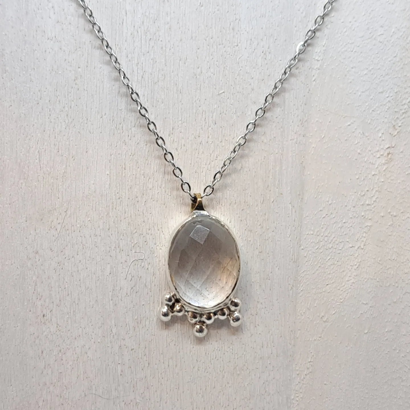 Clear quartz and silver pendant