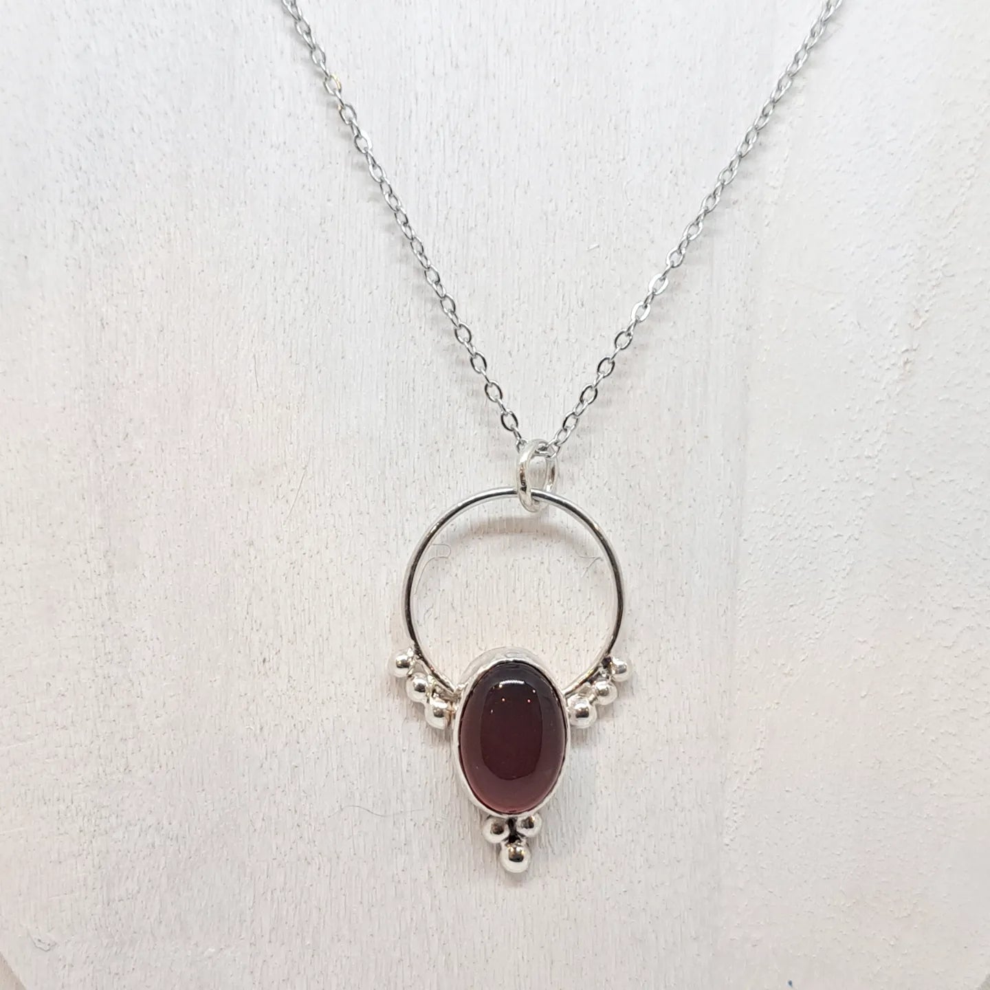 Red agate and silver pendant